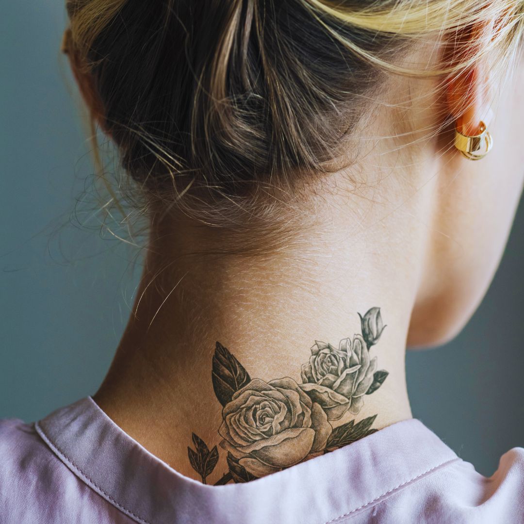 floral tattoo on a woman's neck